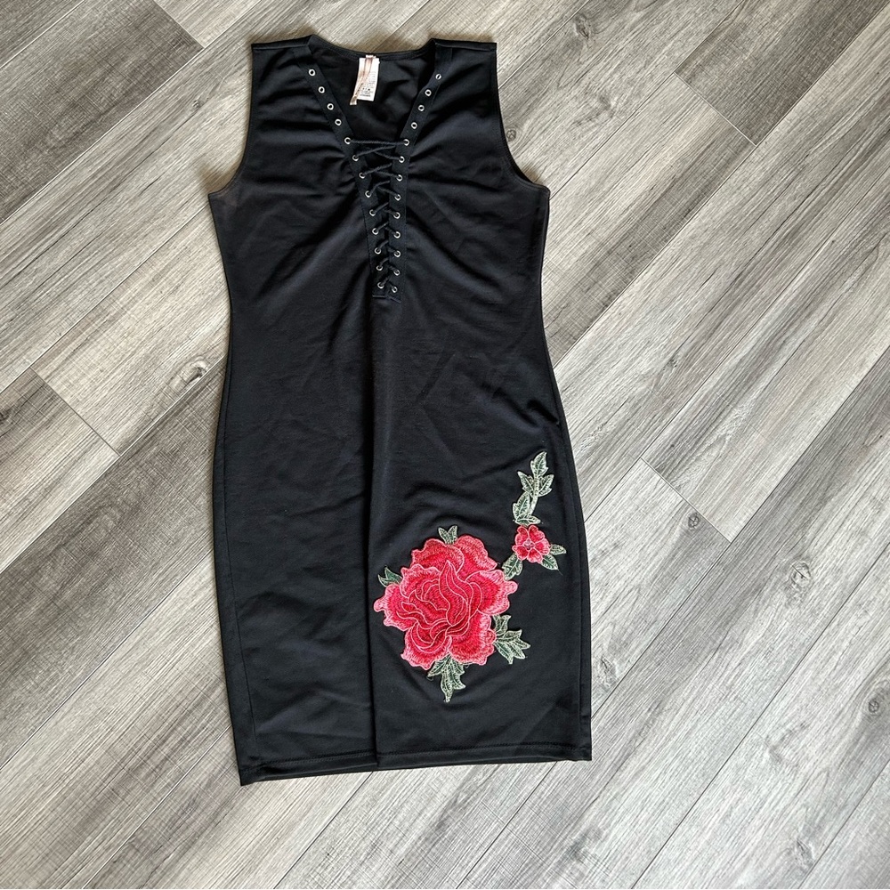 Black dress with a rose on it